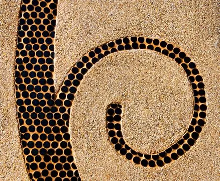 The abstract ceramic spiral on pebble background Stock Illustration