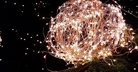 Abstract Christmas glitter lights ball on xmas tree with warm sparkle bokeh Stock Footage 83746151