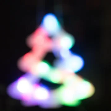 Abstract christmas tree night light bokeh, defocused background Stock Photos