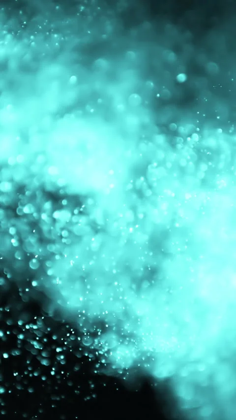 Abstract cinematic glittering particles in motion on black background. Vertical Stock Footage 271378156