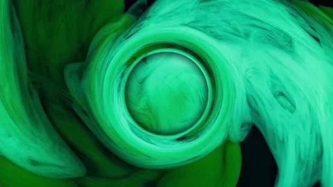 Abstract circle green ink drops from above mixing in water, swirling softly Stock Footage 166335269