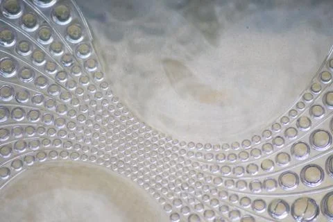 Abstract circle pattern in a glass brick as glass background Stock Photos