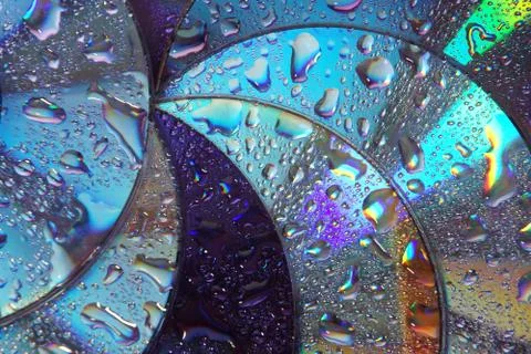 Abstract circles background. CDs SD multicolor water drops background Stock Photos