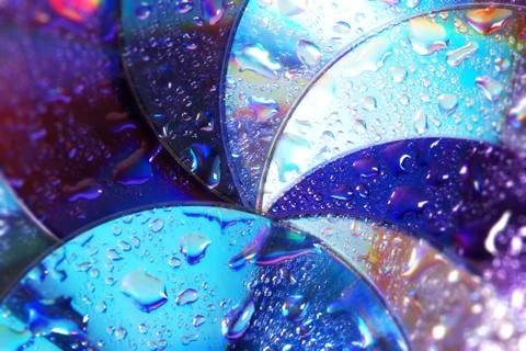 Abstract circles background. CDs SD multicolor water drops background Stock Photos