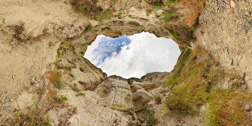 Abstract circular cliffs wrapped up into a hole shape Stock Photos
