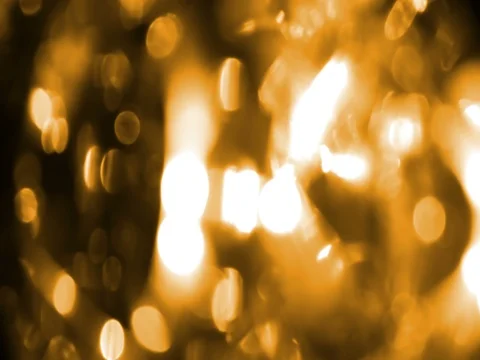 Abstract circular golden sparkle glitter bokeh flowing movement on black Stock Footage
