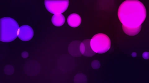 Abstract circular purple sparkle glitter bokeh flowing movement on dark back Stock Footage 145359176