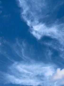 Abstract Cirrus Clouds In Deep Blue Sky Stock Photos