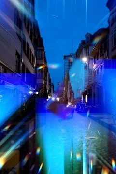 Abstract cityscape blending architectural elements with blue light streaks Illustrazione stock