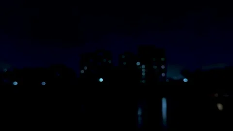 Abstract cityscape with blurred lights creating a dreamy atmosphere in deep.. Stock Footage 340219784