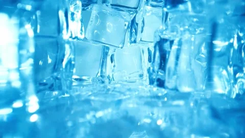 Abstract Close-Up of Blue Ice Cubes in Water Stock Footage 308632599