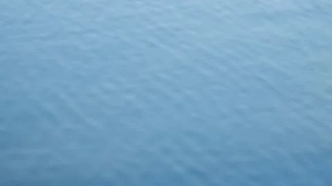 Abstract close-up of blue rippling lake water surface Stock Footage 332293504