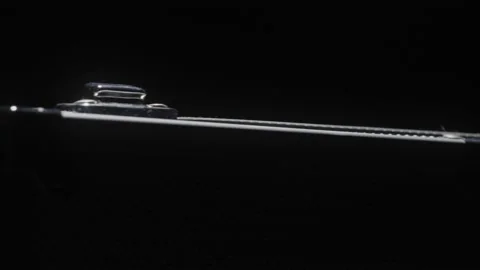 Abstract Close-up of Briefcase Under Bright Light in Dark Room Stock Footage 208801425