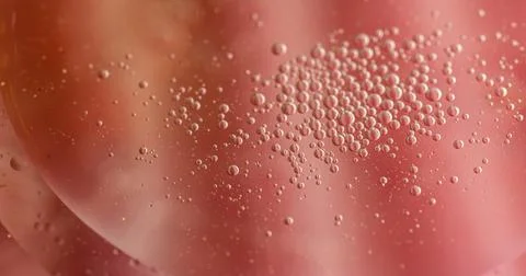Abstract close-up of bubbles in a red liquid.  Intriguing texture and color.. Stock Photos