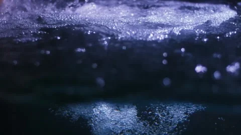 Abstract close-up of bubbling water, possibly a waterfall or stream. Stock Footage 341348558