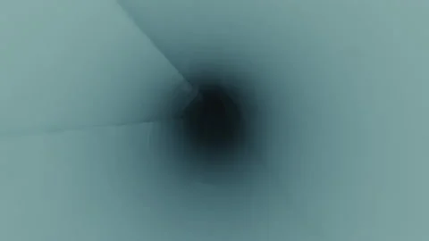 Abstract close up of dark end of cylinder, water flowing down towards middle Stock Footage 208802387