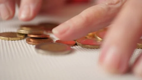 Abstract close up of female hands sorting euro coins on the table 스톡 동영상 121728831