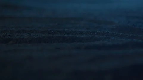 Abstract Close-up of Lightning Storm Reflecting Off of Sand at Night Stock Footage 208802158