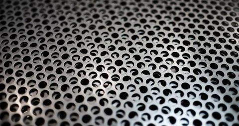 Abstract close up macro perforated dot holes texture in black and white. Foto stock
