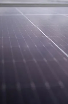 Abstract close-up of a modern solar panel surface, focusing on grid lines a.. Stock Photos