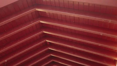 Abstract Close-Up of Red Wooden Ceiling with Geometric Patterns in Sunlight Stock Footage 283284304