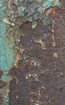 Abstract close-up of rust and aged paint on a corroded metal surface. Stock Photos
