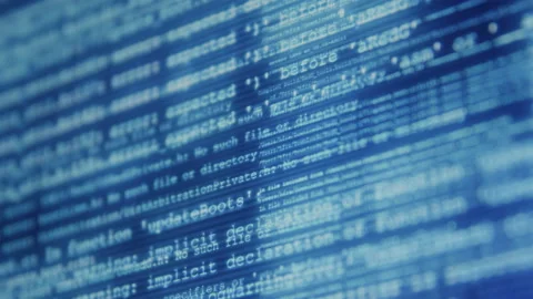 Abstract Close up of Virus Cyber Attack Scrolling Across Computer Screen Video stock 219583090