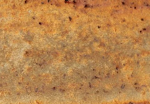 Abstract close-up of a weathered, earthy surface with warm tones and irregu.. Foto stock