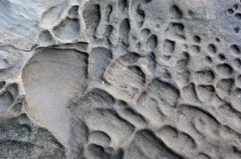 Abstract closeup of eroded texture on the beach Stock Photos