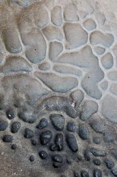 Abstract closeup of eroded texture on the beach Stock Photos