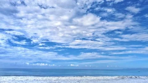 Abstract cloud pattern above the blue sea,wide perspective view Stock Photos