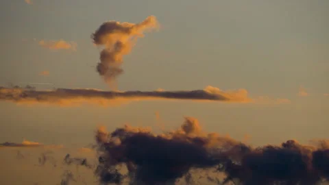 Abstract Cloud Shapes in Warm Golden Light at Sunset Stock Footage 318296665