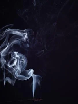 Abstract cloud of white smoke from burning incense, isolated on black background 스톡 사진