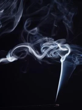 Abstract cloud of white smoke from burning incense, isolated on black background Stock Photos