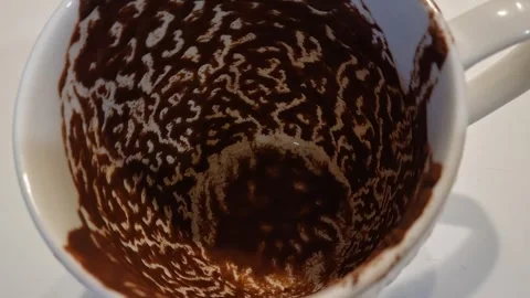 Abstract coffee residue patterns inside white cup after Greek coffee Stock Footage 334821202