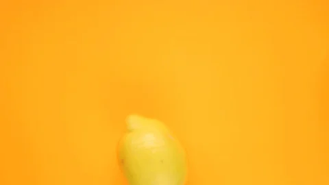 Abstract color animation of moving lemon on orange background Stock Footage 128896781
