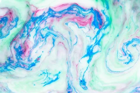 Abstract colored background. Stains of paint on the water. Ebru art, marbled Stock Photos