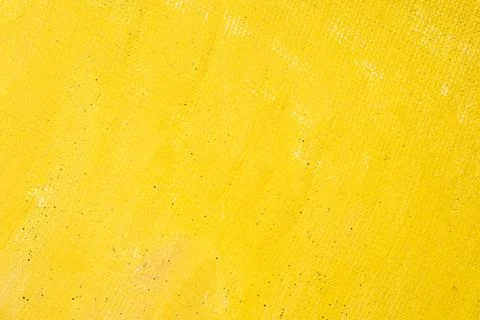 Abstract colored creative background: stains of yellow paint-primer on rough  Stock Photos