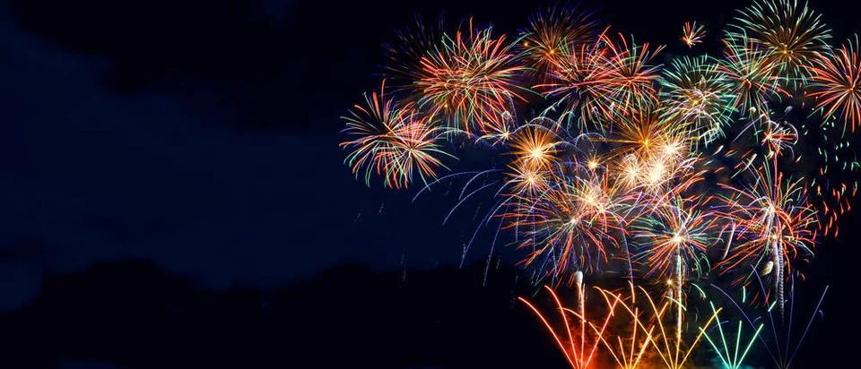Abstract colored firework on dark sky. Celebration and anniversary concept... Stockfoto's
