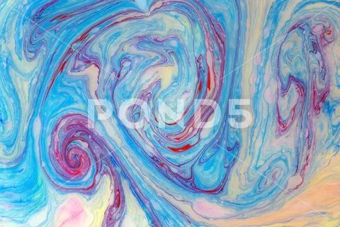 Abstract colored marble background. Stains of paint on the water. Stock Photos