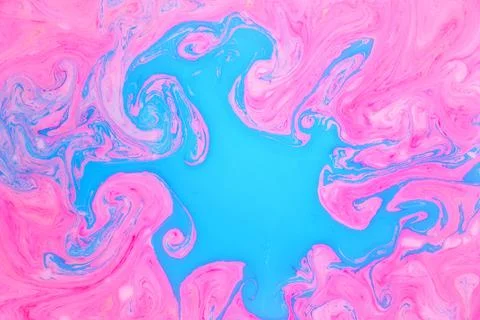 Abstract colored marble background, stains of pink and blue paint on the surface Stock Photos