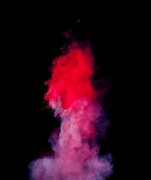 Abstract colored powder explosion isolated on black background. Stock Photos