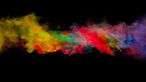 Abstract colored powder explosion isolated on black background. Stock Photos