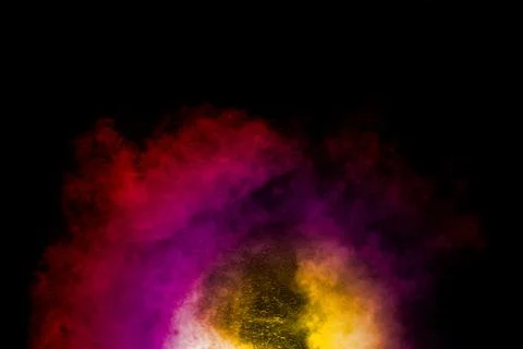 Abstract of colored powder explosion isolated on black background. Stock Photos