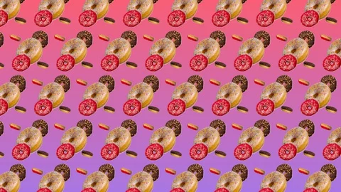 Abstract colorful animation - different donuts move to the side on pink gradi Stock Footage 129048286