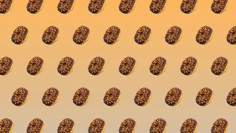 Abstract colorful animation - side view donuts with chocolate and caramel mov 스톡 동영상 129080446
