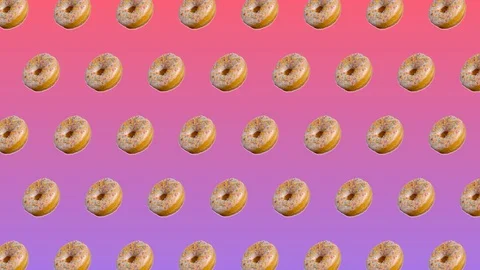 Abstract colorful animation - side view donuts with colorful sugar sprinkles  Stock-Footage 129080502