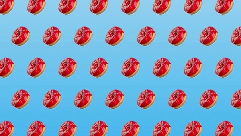Abstract colorful animation - side view pink donuts move to the side on blue  스톡 동영상 129080509