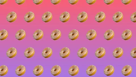 Abstract colorful animation - side view donuts with colorful sugar sprinkles  Stock Footage 129080663