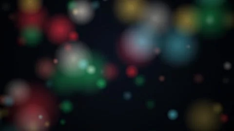 Abstract colorful bokeh lights floating and drifting slowly across a dark black Stockbeeldmateriaal 345427121